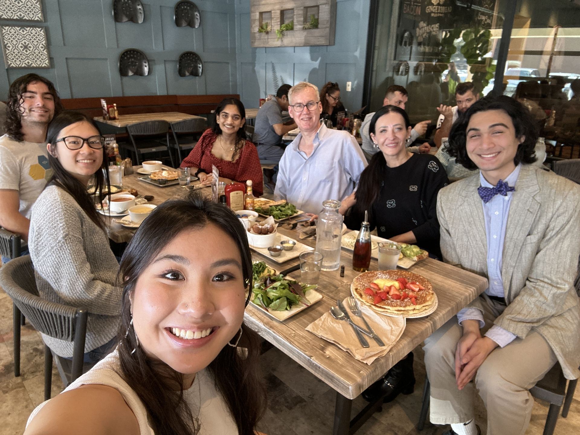 Mentoring relationships between faculty and students are part of the Honors College offerings. Clockwise around the table, starting with Alina Dam (holding camera): Lily Nguyen, Malcolm Hoffman, Chandu Garapaty, Michael Biewer and his wife Mihaela Stefan (both faculty), Charles Birt.